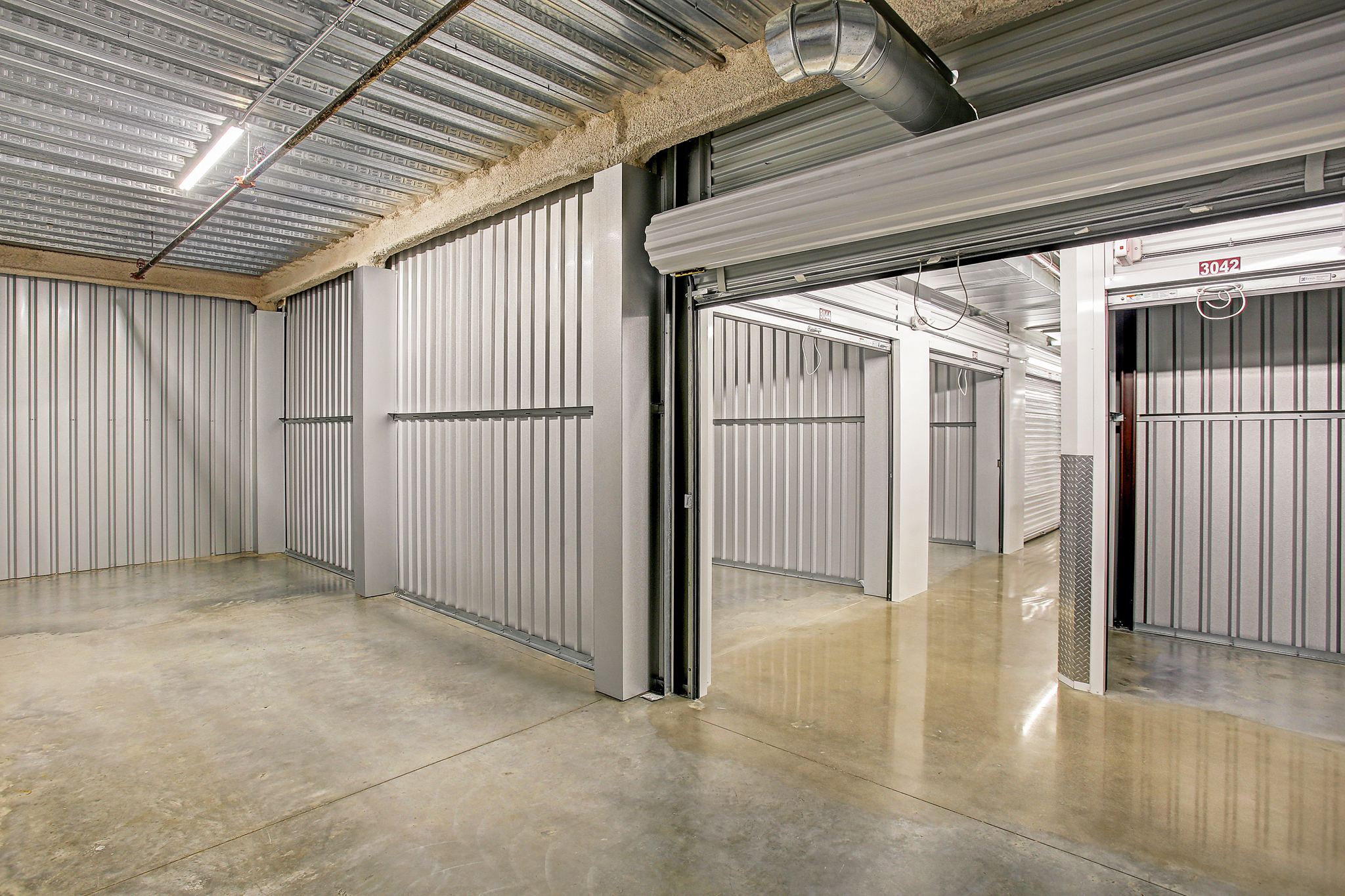 Interior of Big Tex Self Storage facility in Houston, TX, featuring clean, secure storage units with roll-up doors and ample space for storing belongings.