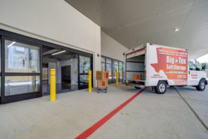 Load area with available moving truck at Big Text Storage Heights location